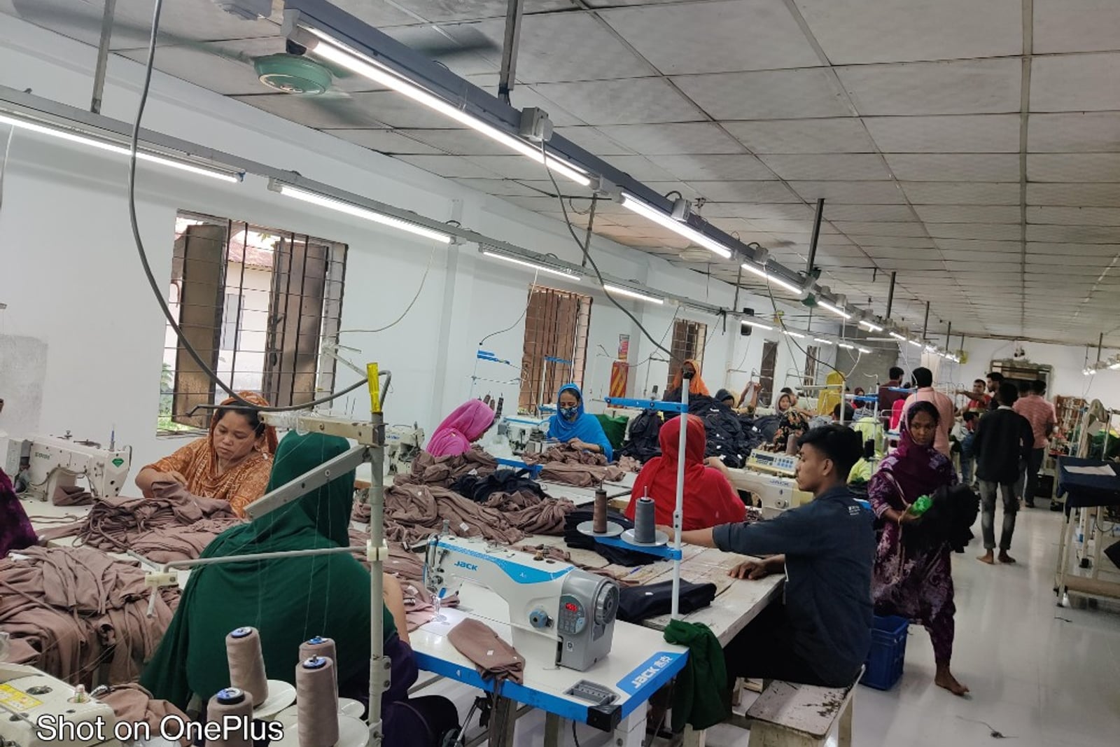 H & MR Supply Chain garments factory — finishing, folding and packing station